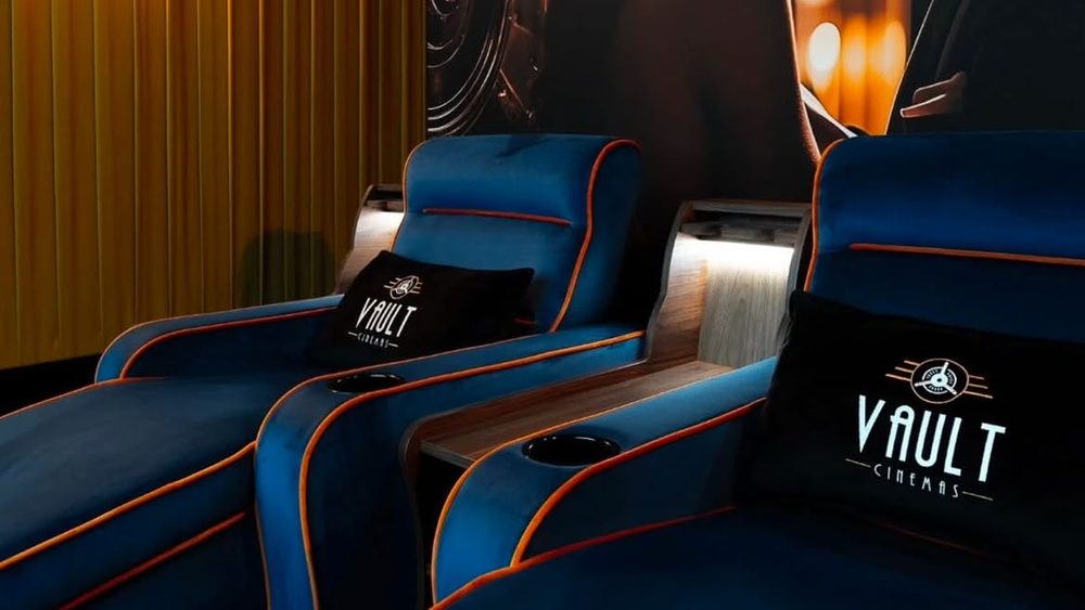 Velvet recliner seats with Vault Cinemas branding at the boutique cinema beneath Real Food Hall