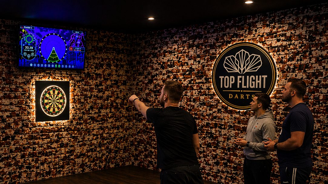 Guests playing darts on Top Flight's electronic boards with Real Food Hall glassware in the foreground